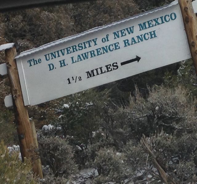 Sign that reads The University of New Mexico D.H. Lawrence Ranch 11/2 miles